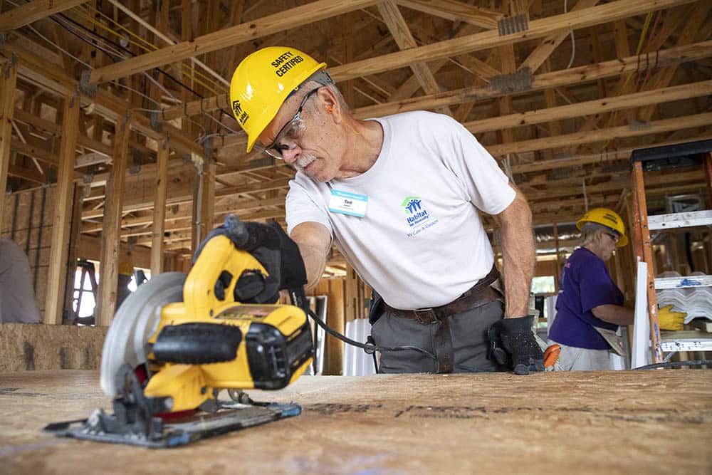 Volunteer cutting materials for new build